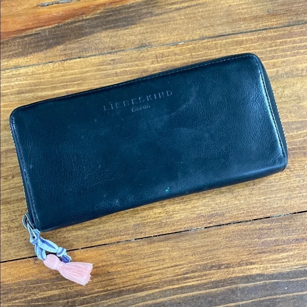 Liebeskind leather wallet full zipper closure tassel pull neutral black minimal